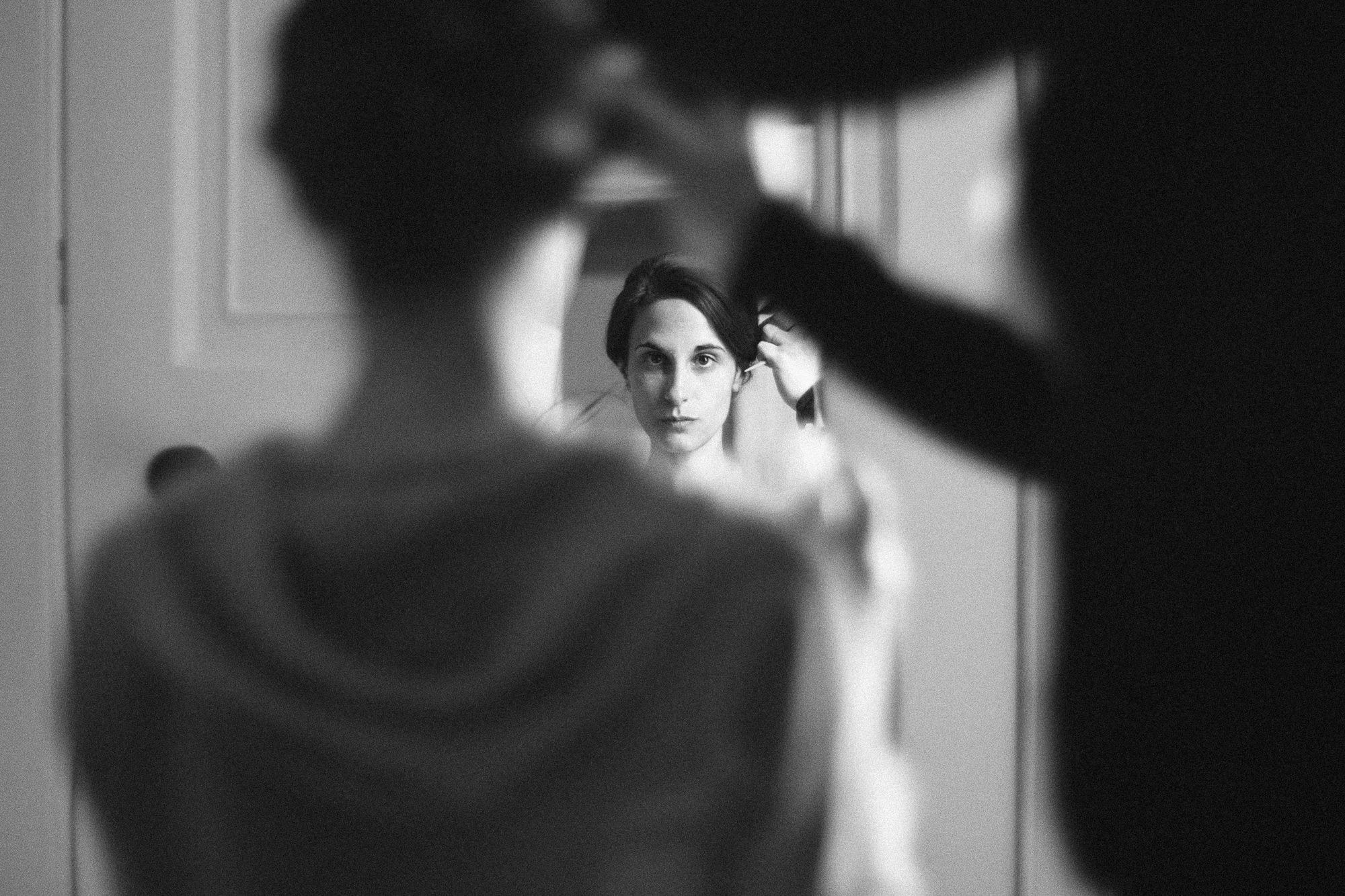 Bridal preparations bride getting her hair done