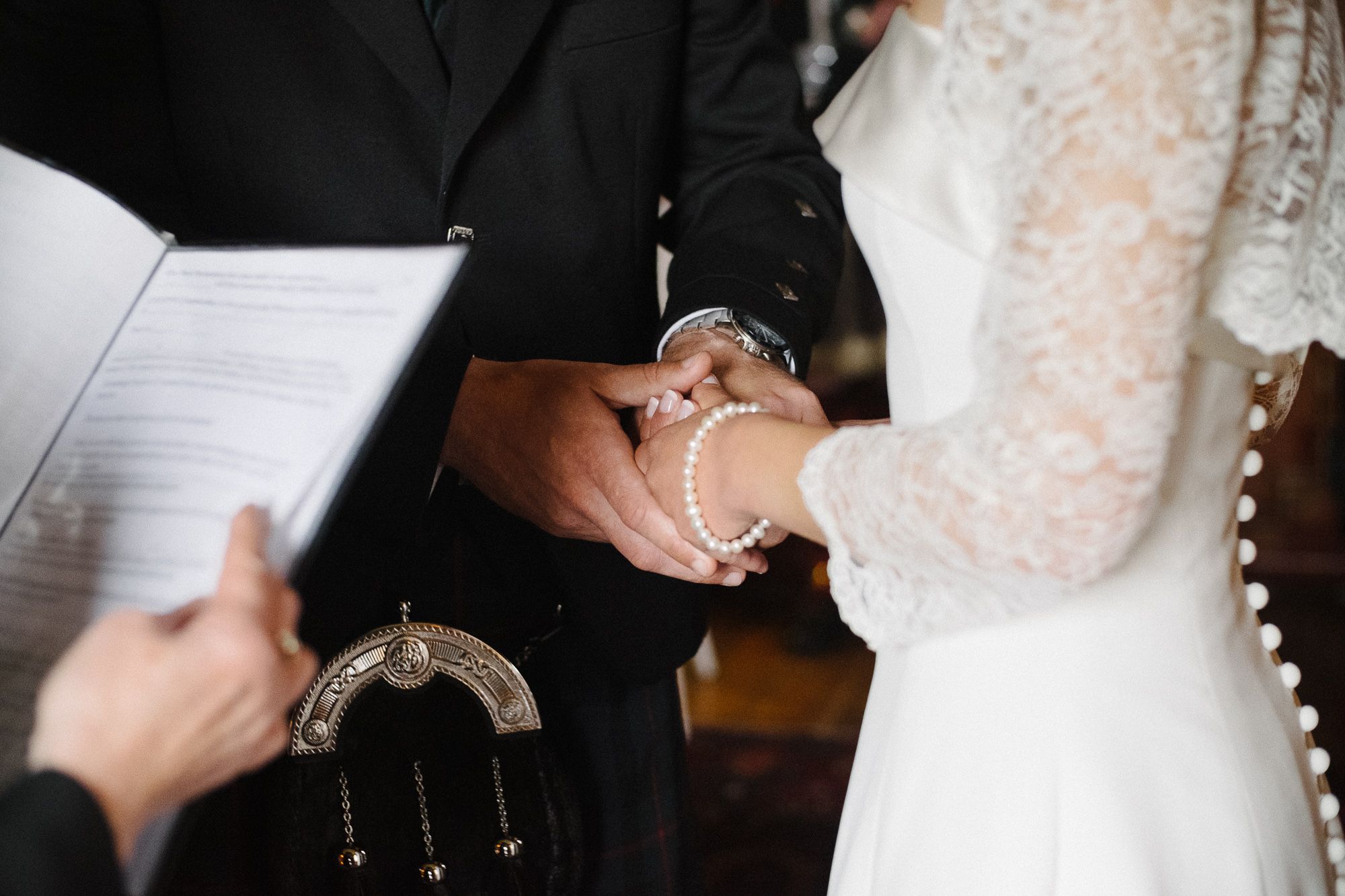 Wedding ceremony at Prestonfield House bride and groom holding hands