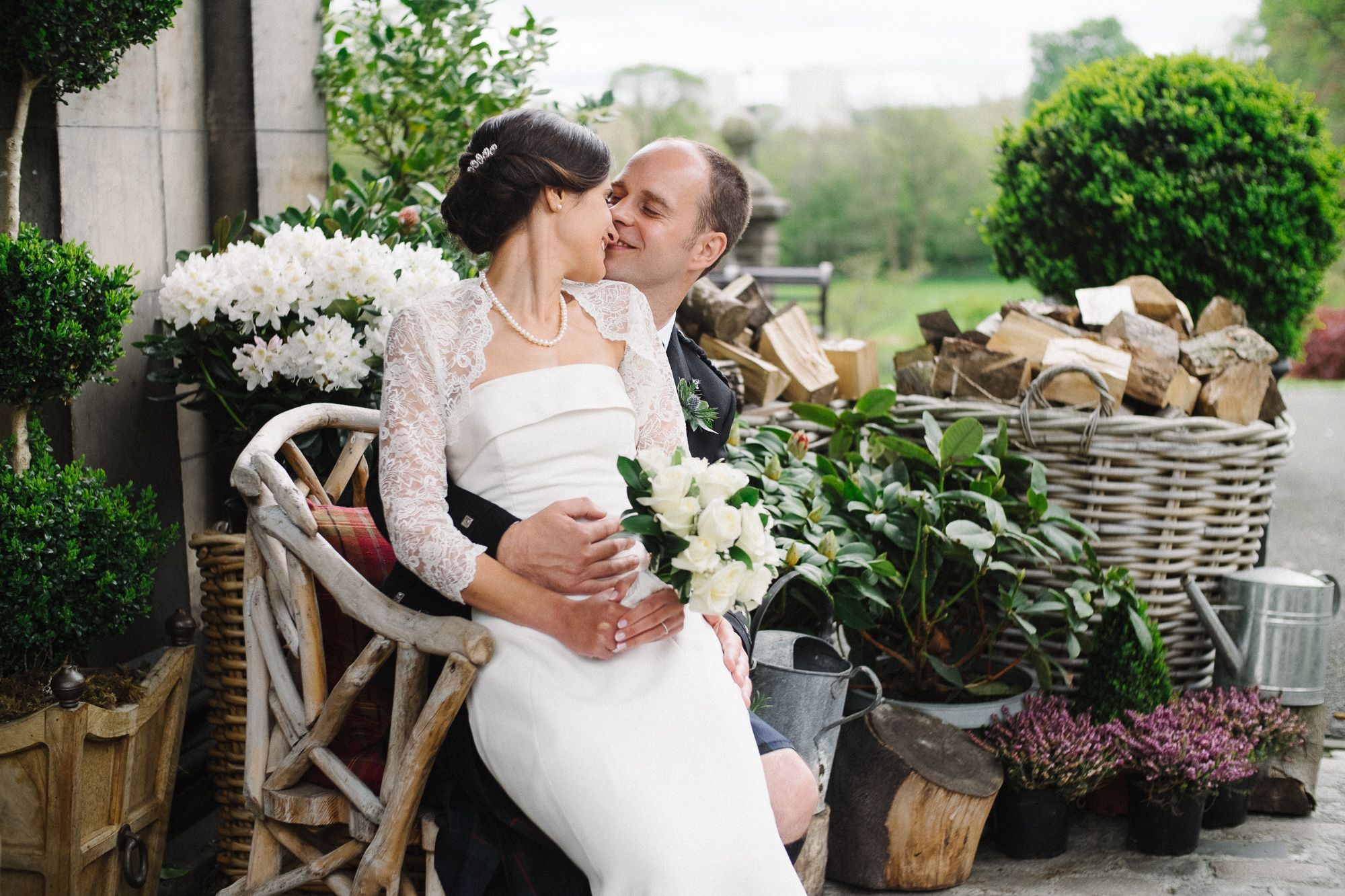 Portrait of bride and groom with wedding bouquet