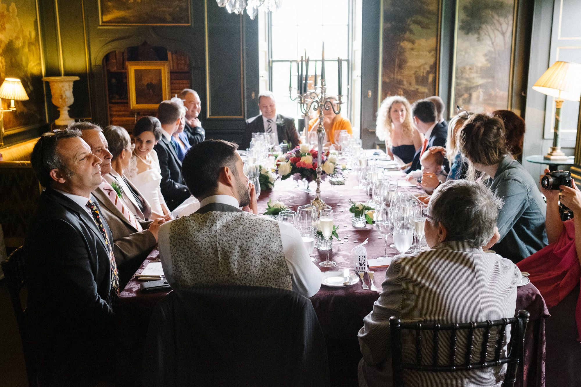 Wedding guests sitting around the table at Prestonfield House Edinburgh