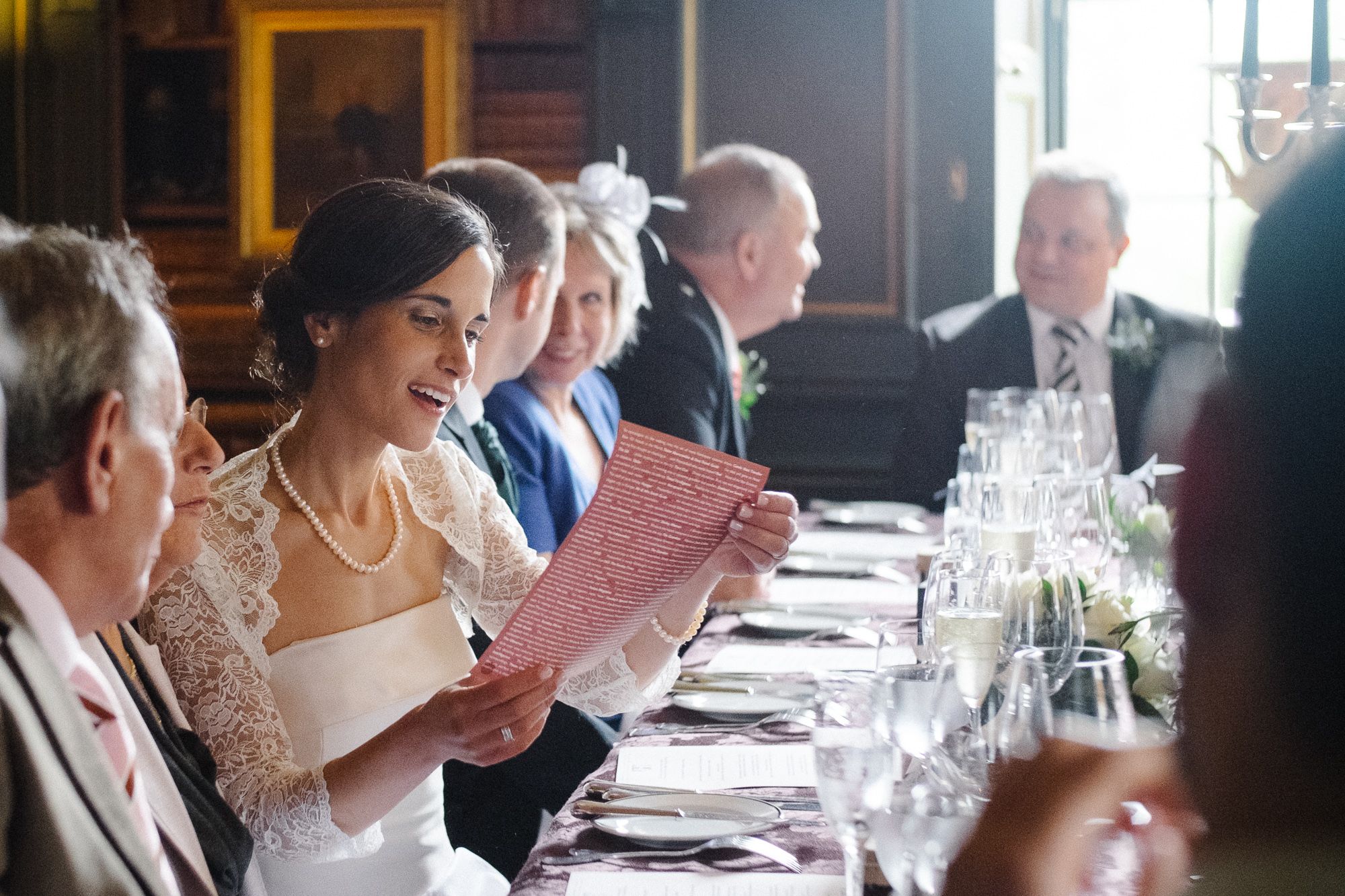 Bride at table chatting woth wedding guests