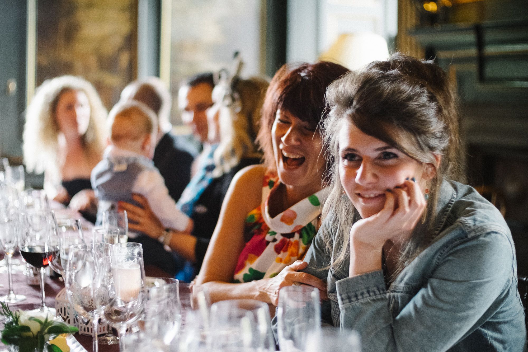 Wedding guests around table enjoying dinner