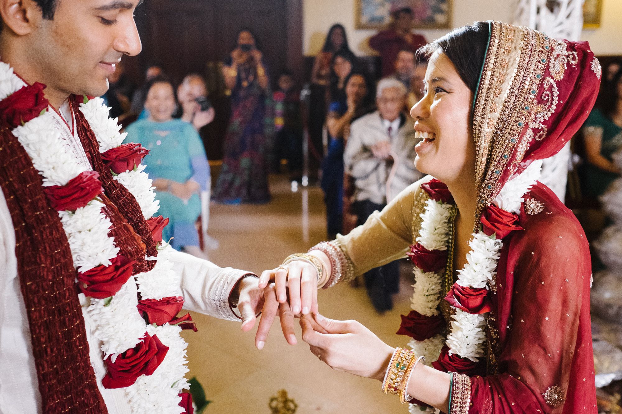 Hindu ceremony bride and groom putting on ring