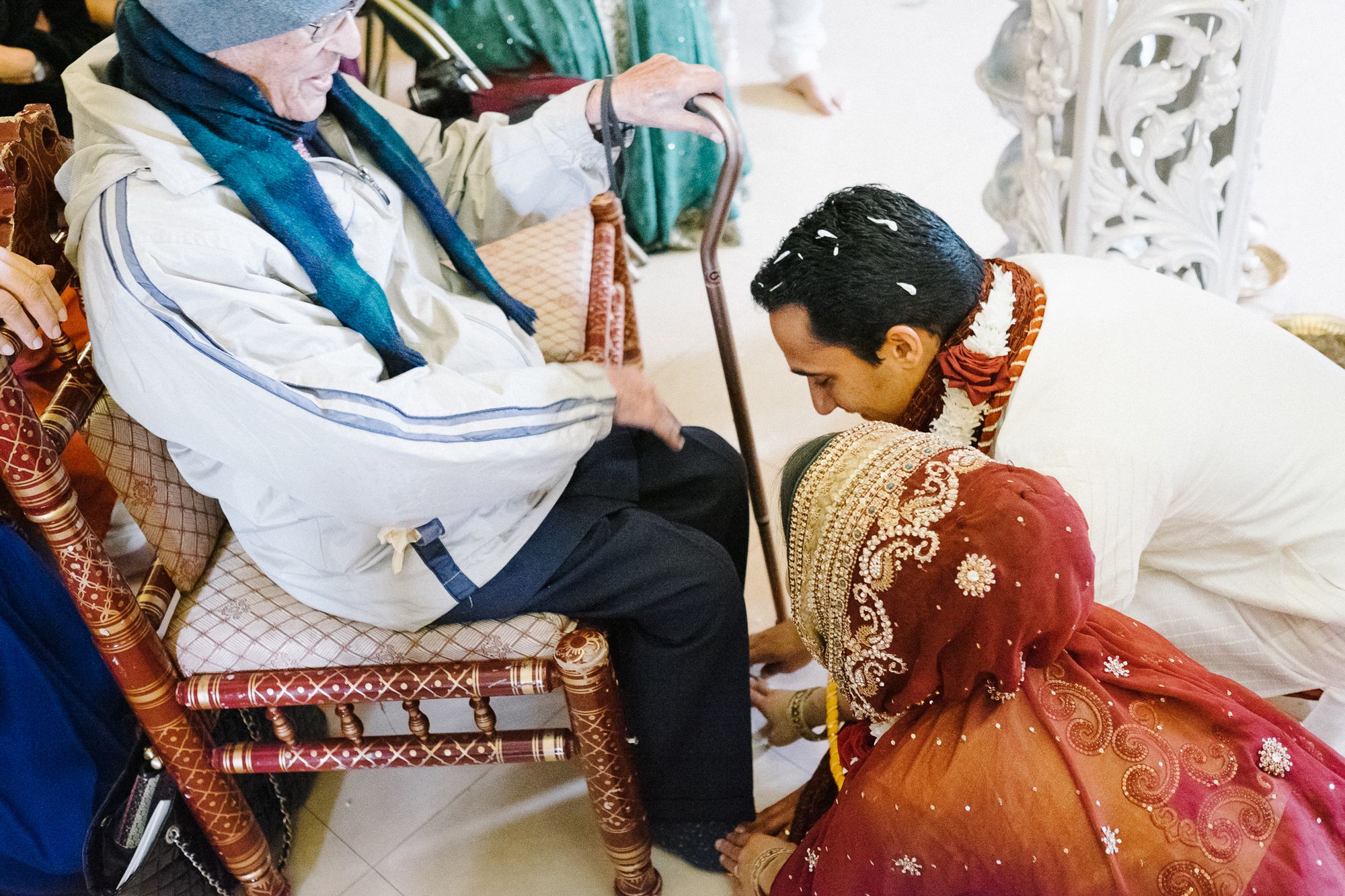 Grandparent blesses bride and groom at Hindu wedding ceremony