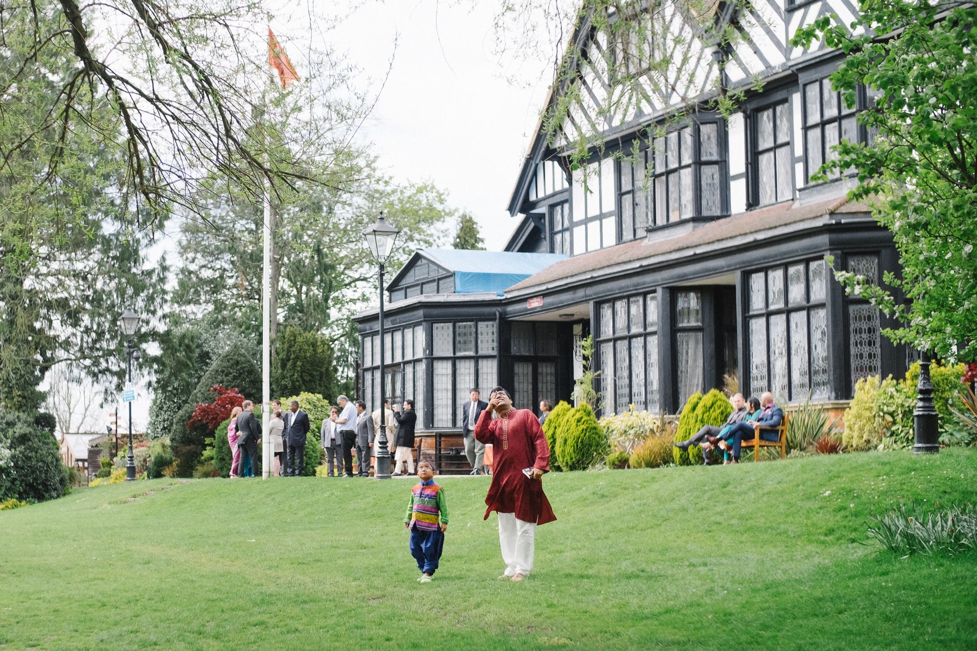 Wedding guests in the Garden of Bhaktivedanta Manor temple London