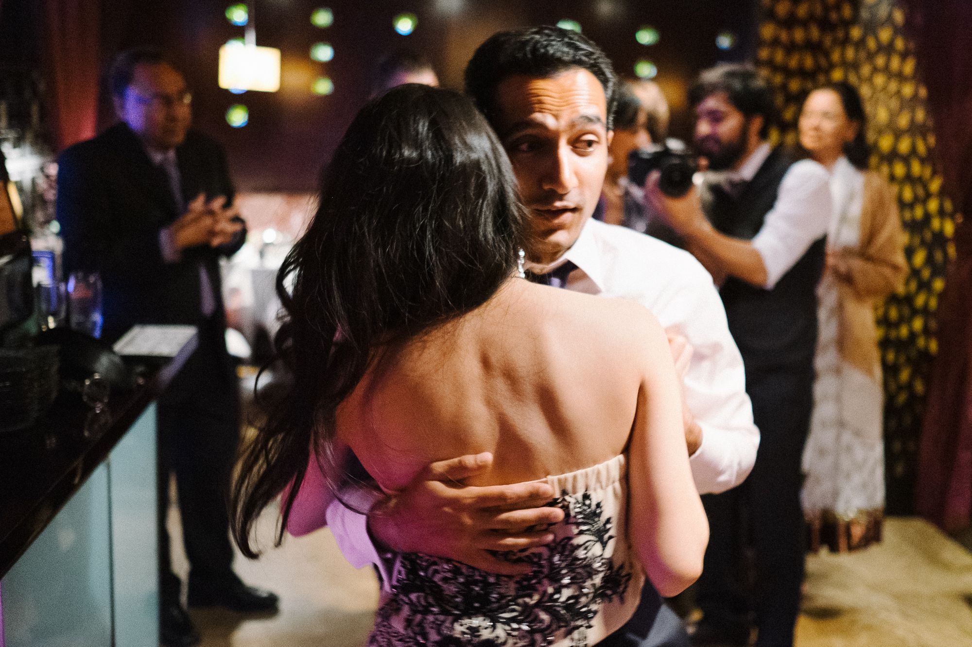 Bride and groom dancing at wedding dinner