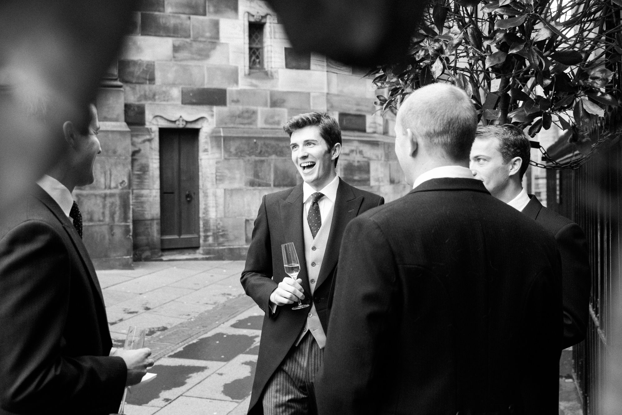 Groom welcoming guests at The Signet Library