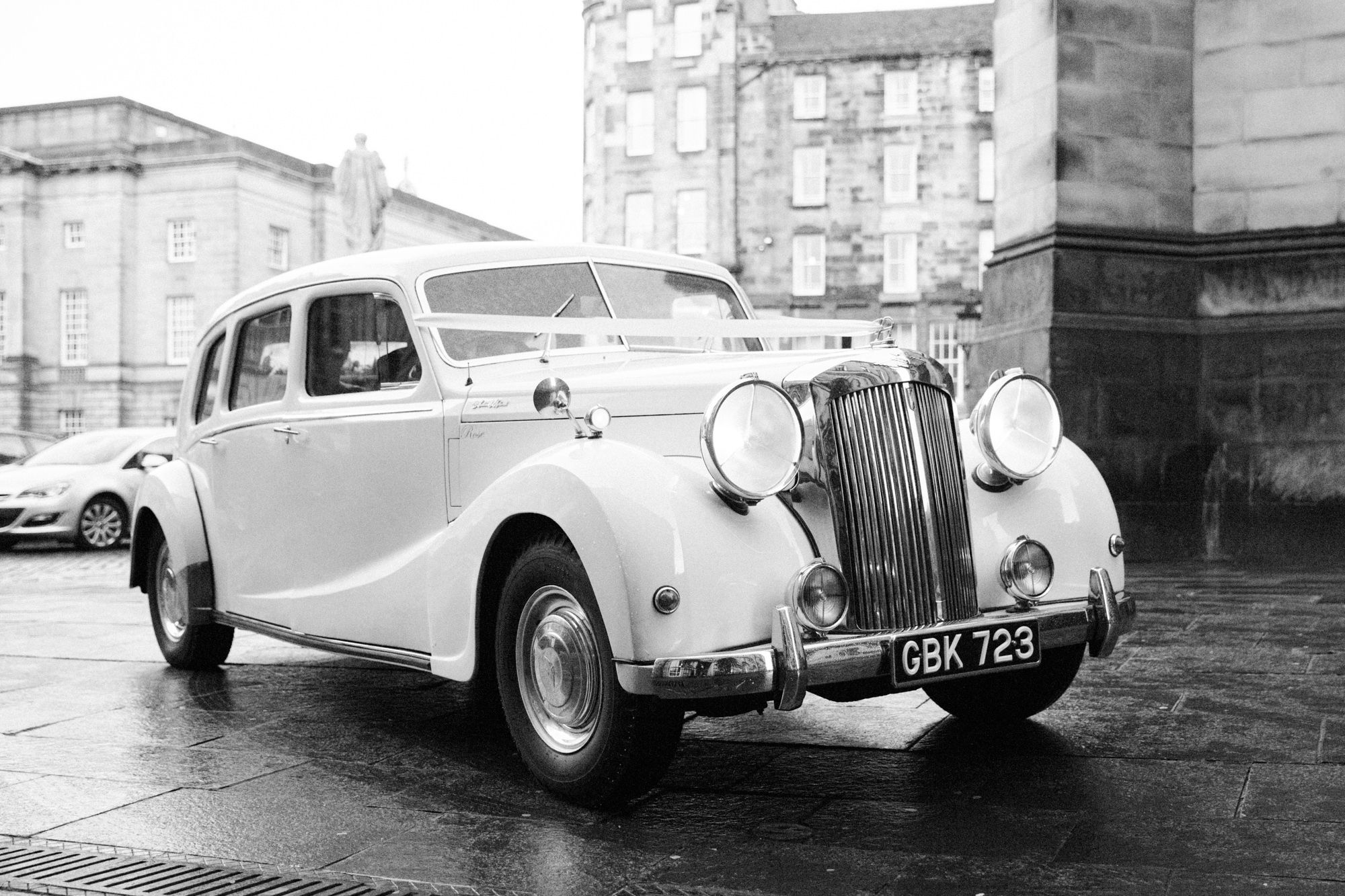 Bride arriving in a vintage car at The Signet library