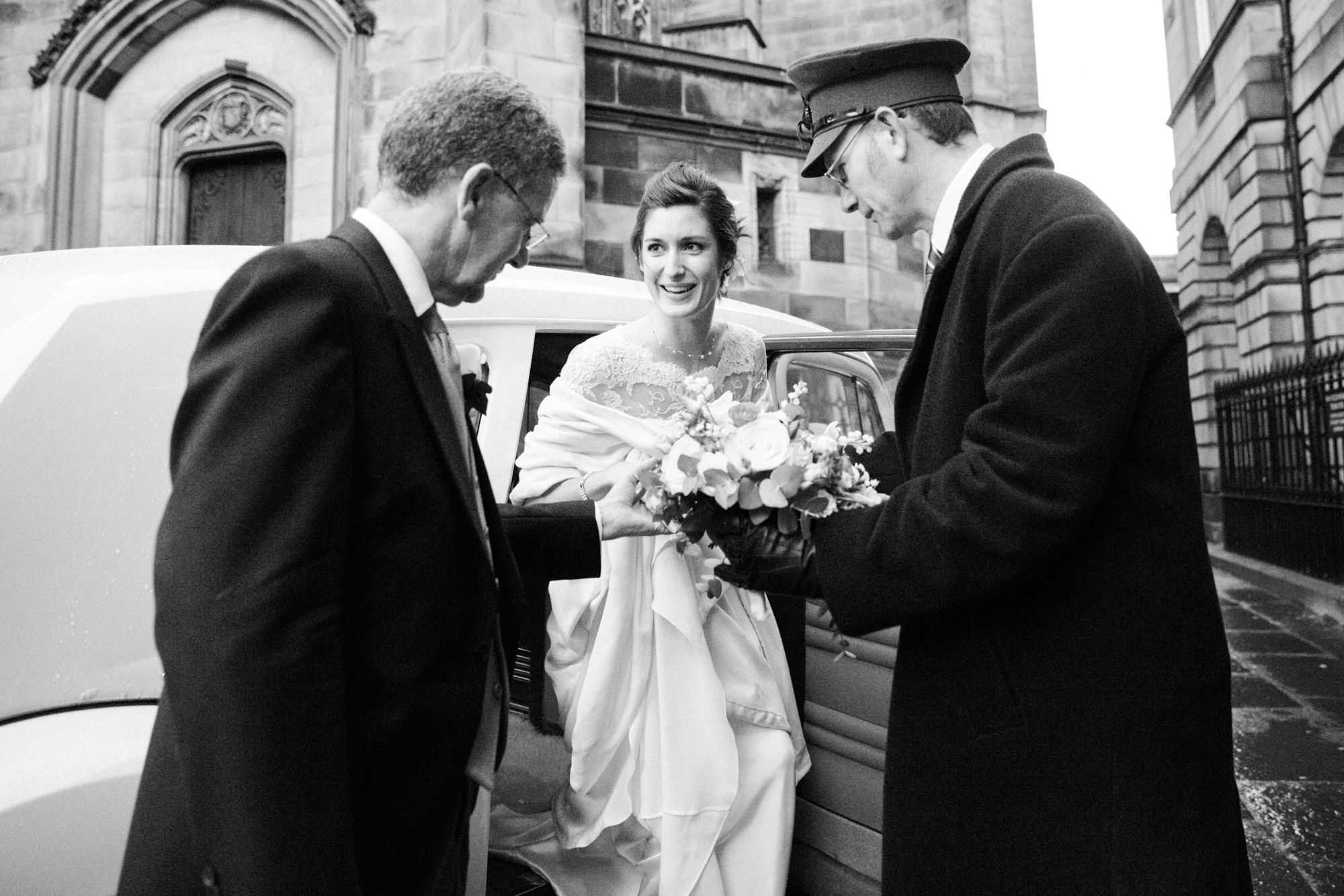 Bride arriving in a vintage car at The Signet library