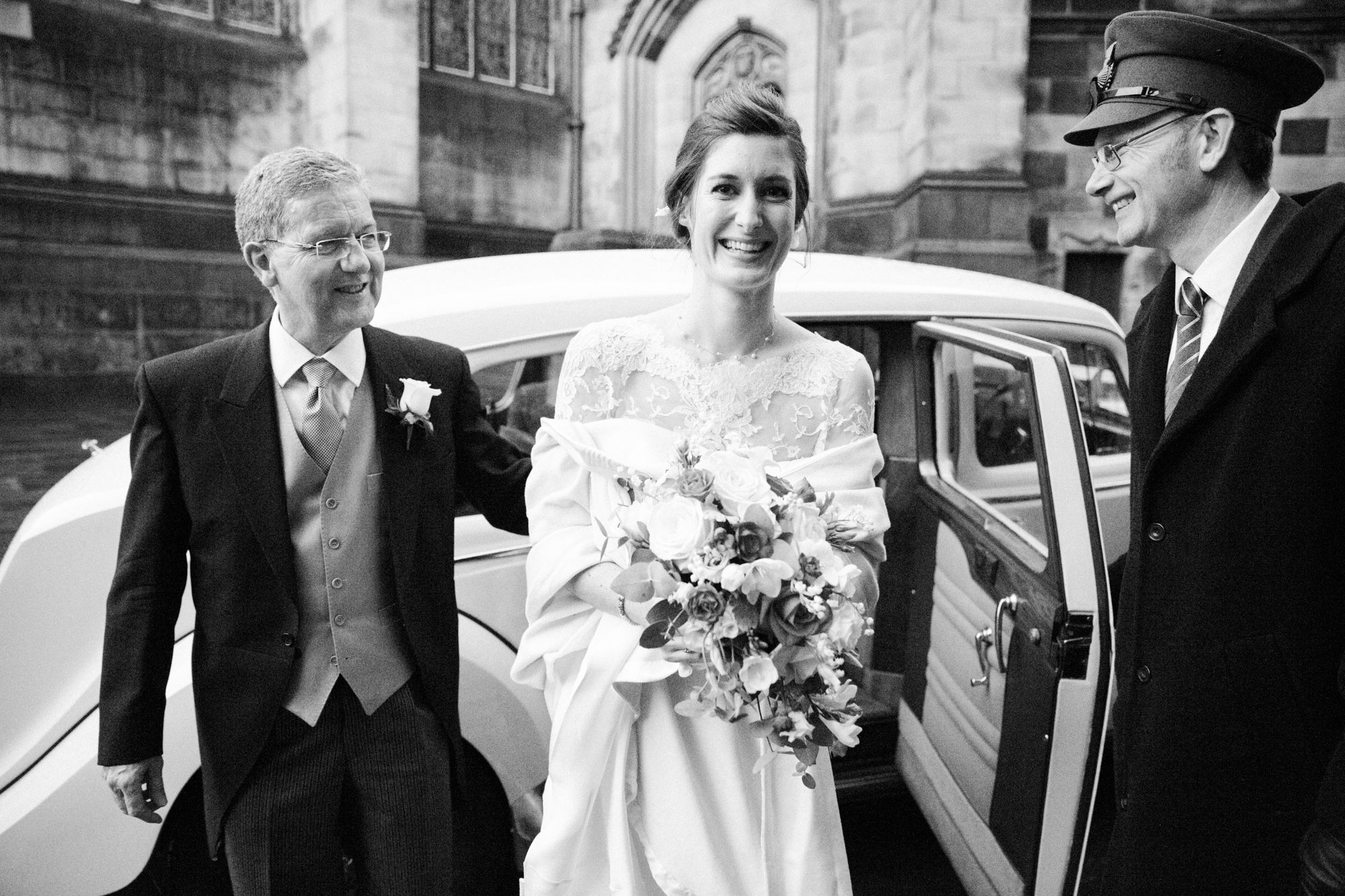 Bride arriving in a vintage car at The Signet library