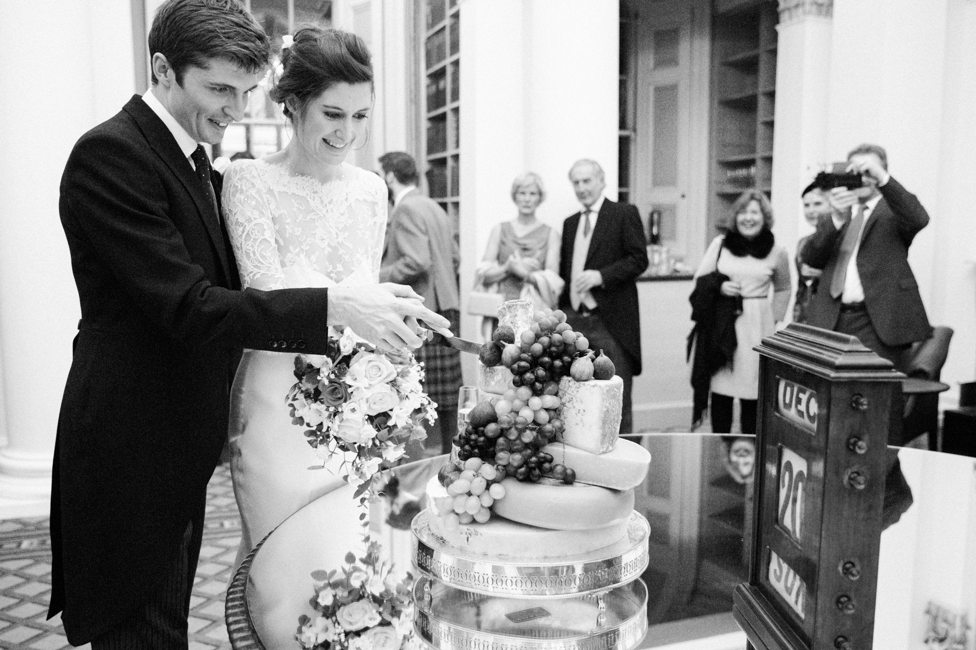 Bride and groom cuts the cake at The Signet Library