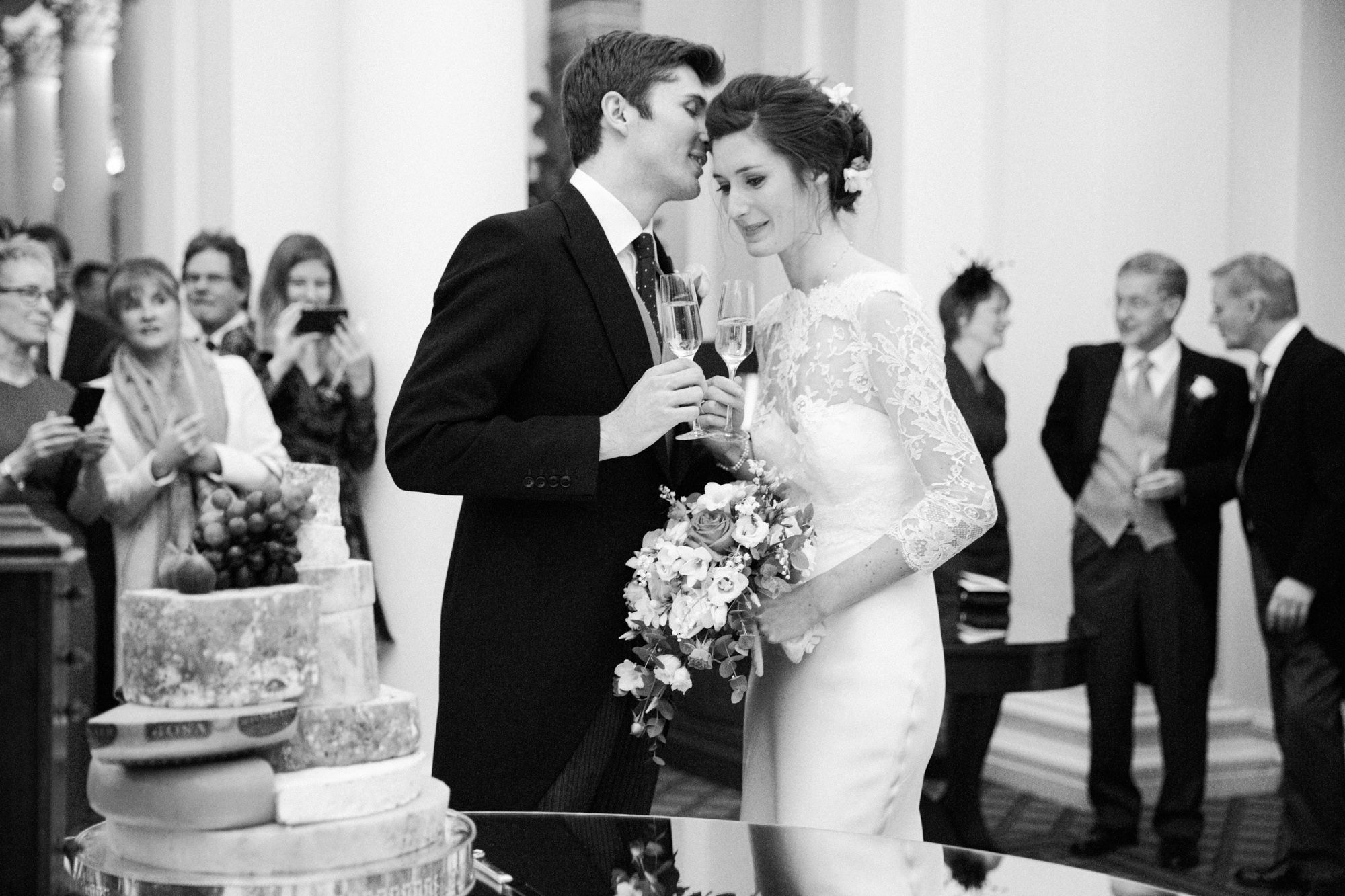 Bride and groom cuts the cake at The Signet Library