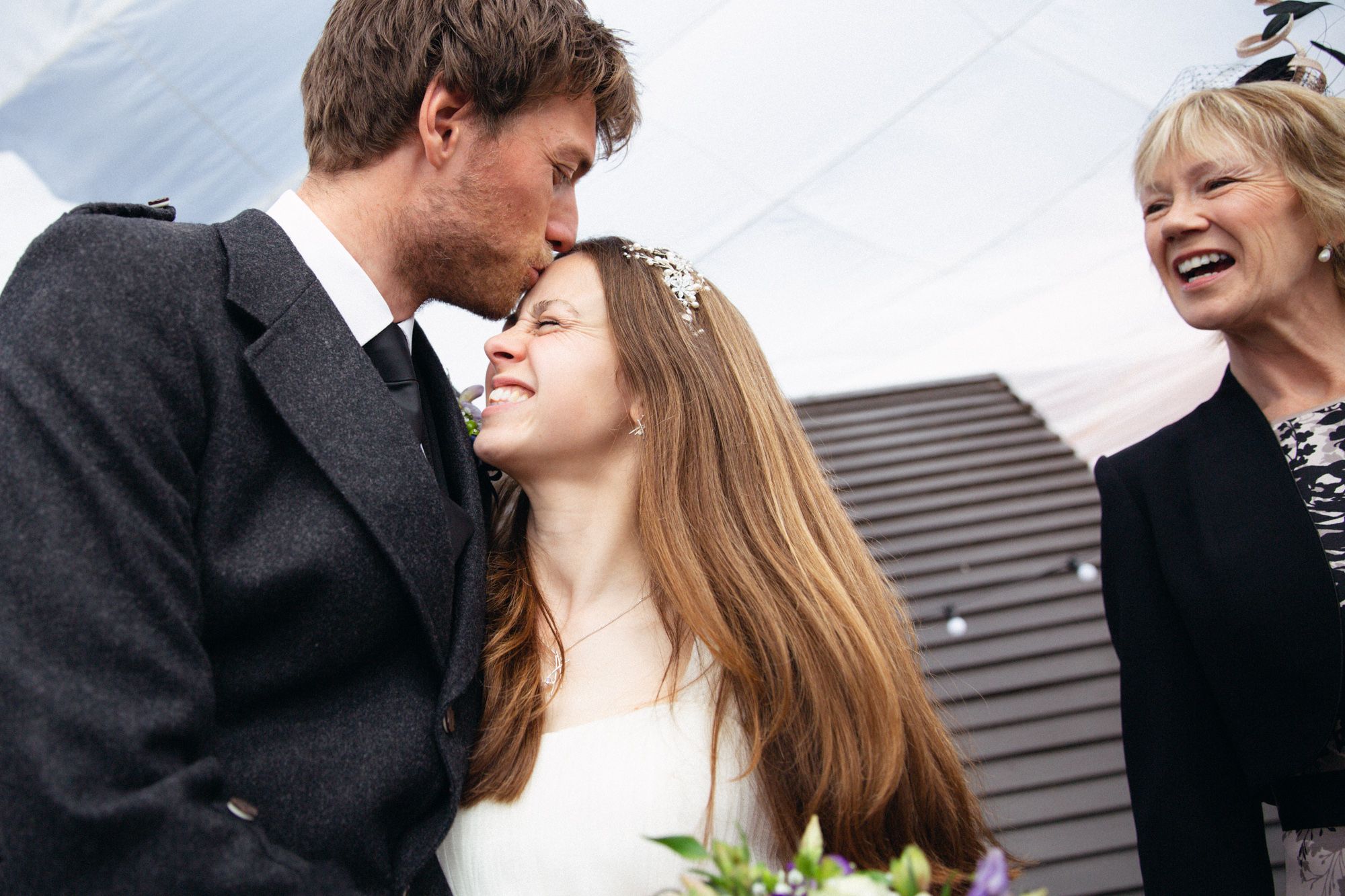 Scottish bride and groom with mother of the bride