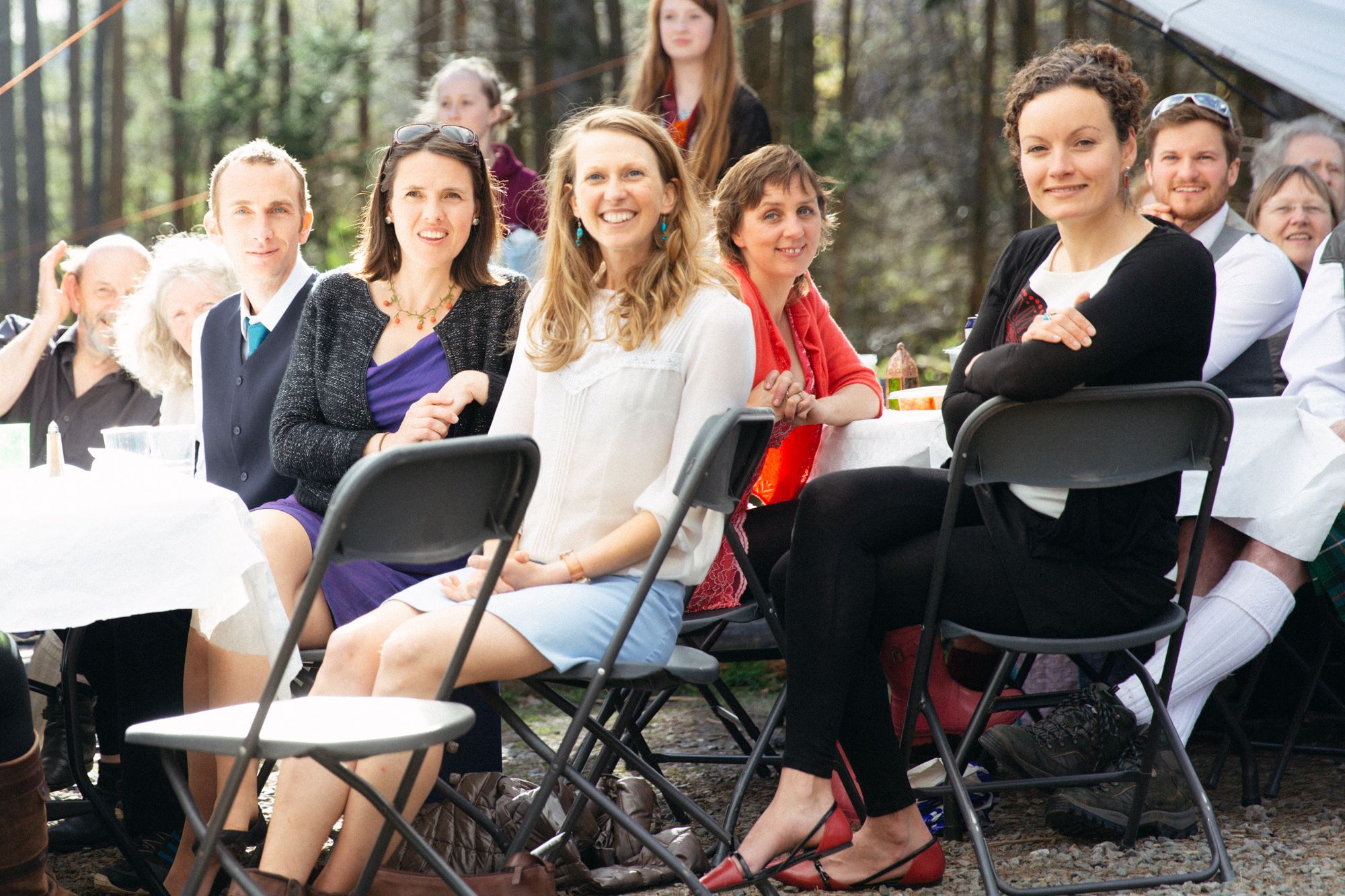 Rustic rural spring wedding guests listening to speeches