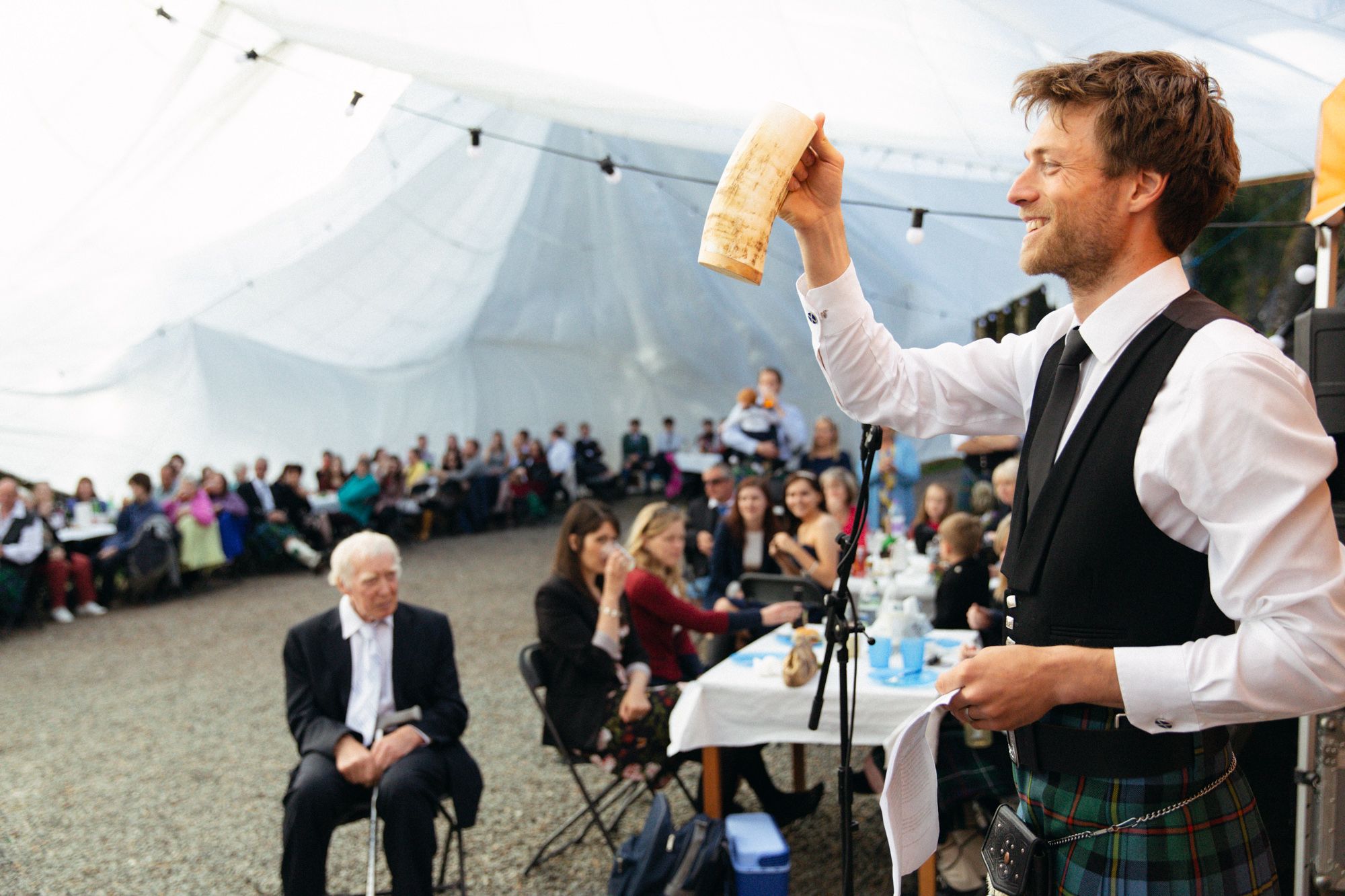 Rustic wedding groom giving speech