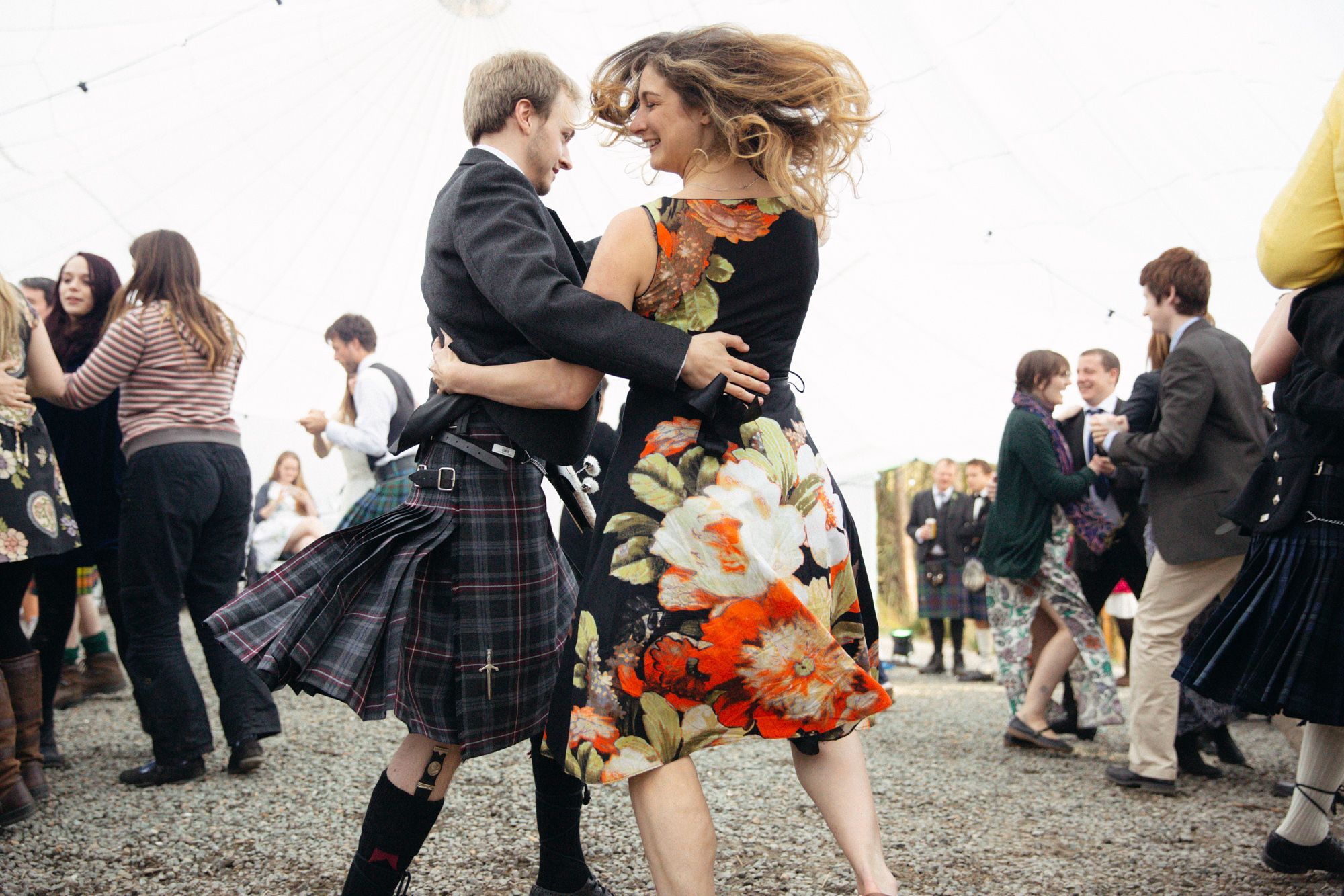 Rustic rural spring wedding guests dancing