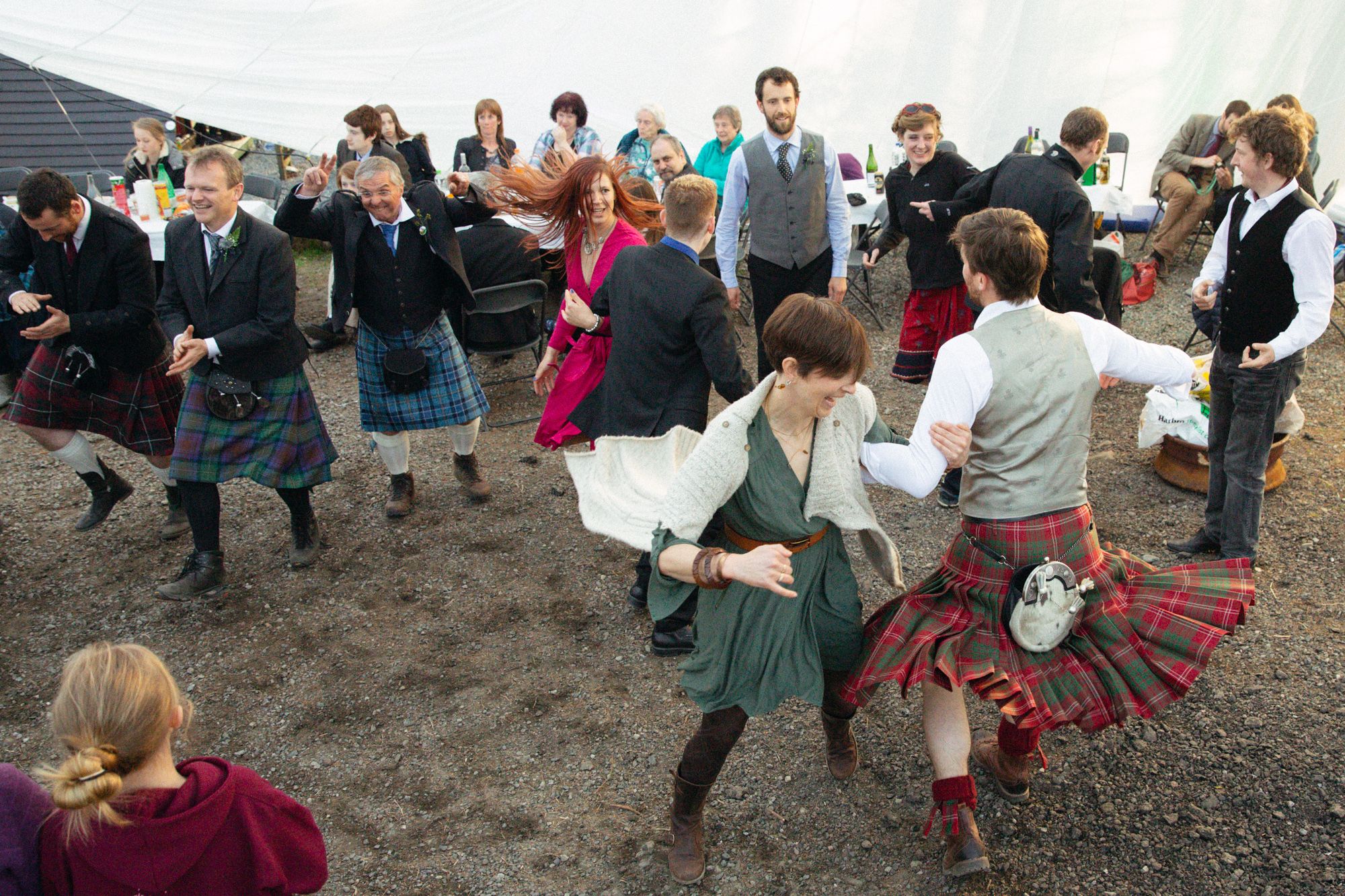 Rustic rural spring wedding guests dancing