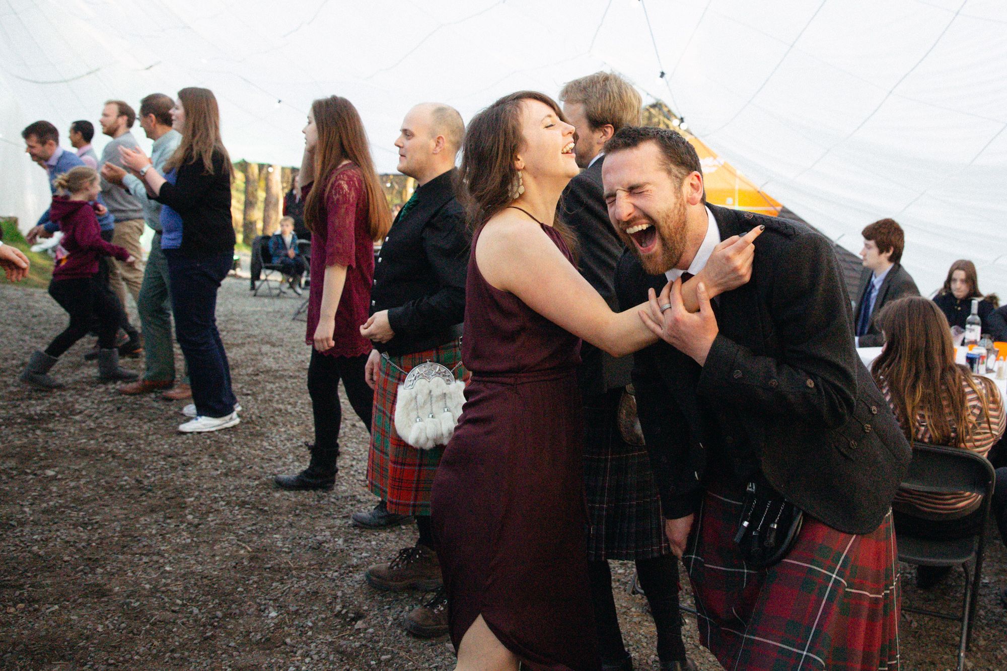 Rustic rural spring wedding guests dancing