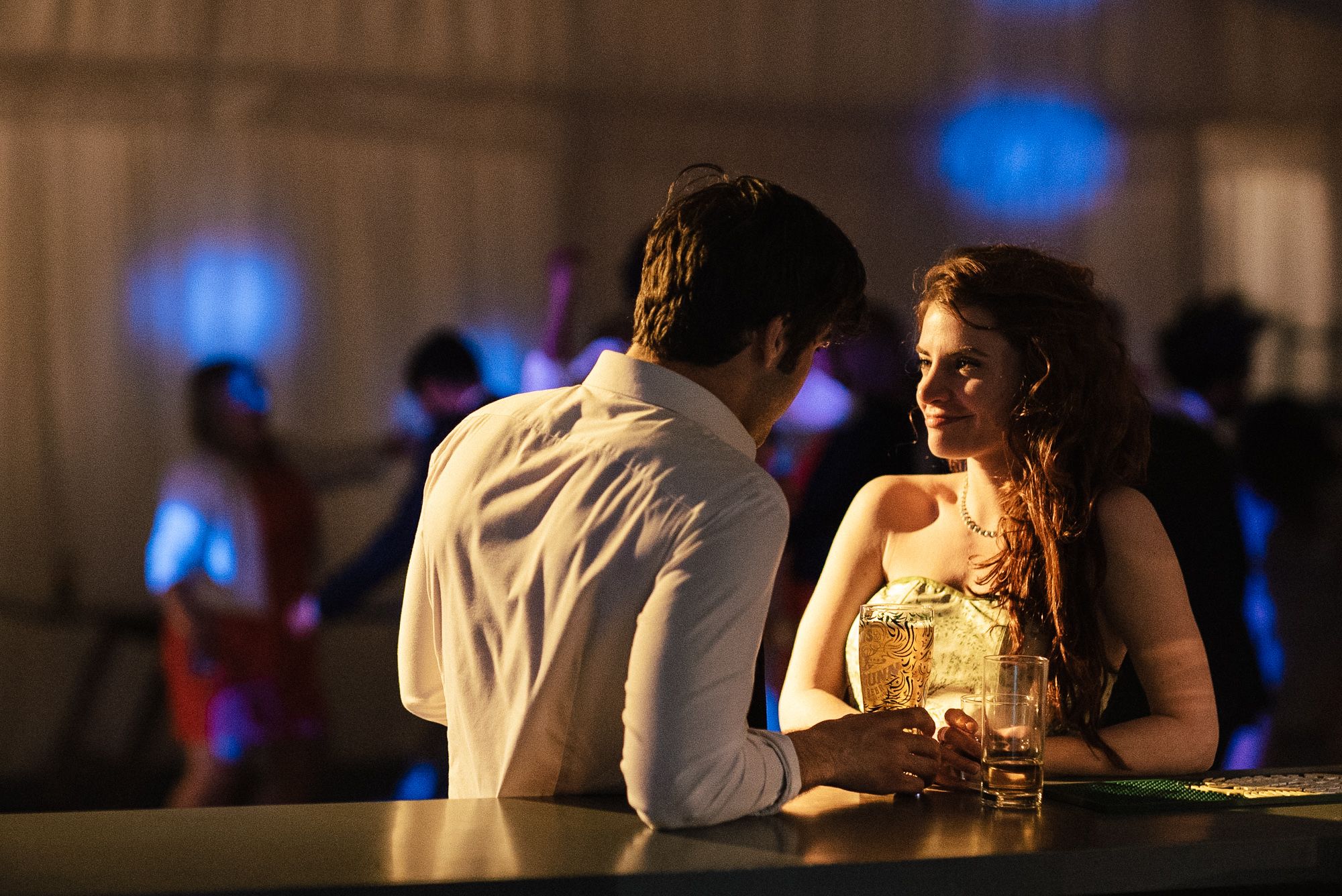 Wedding guests chatting at bar