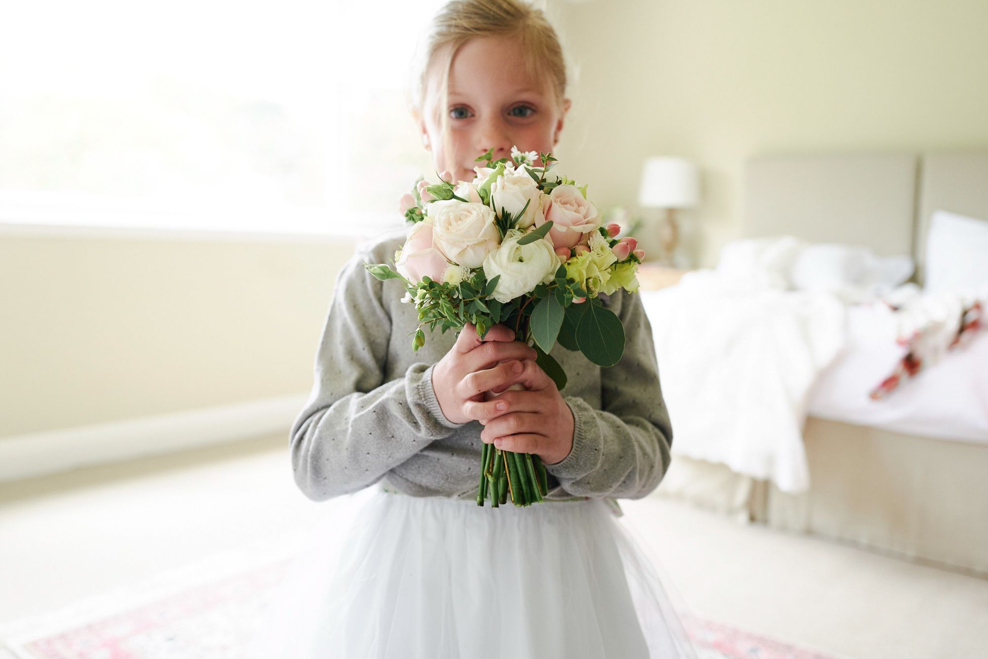 Little girl with wedding bouquet