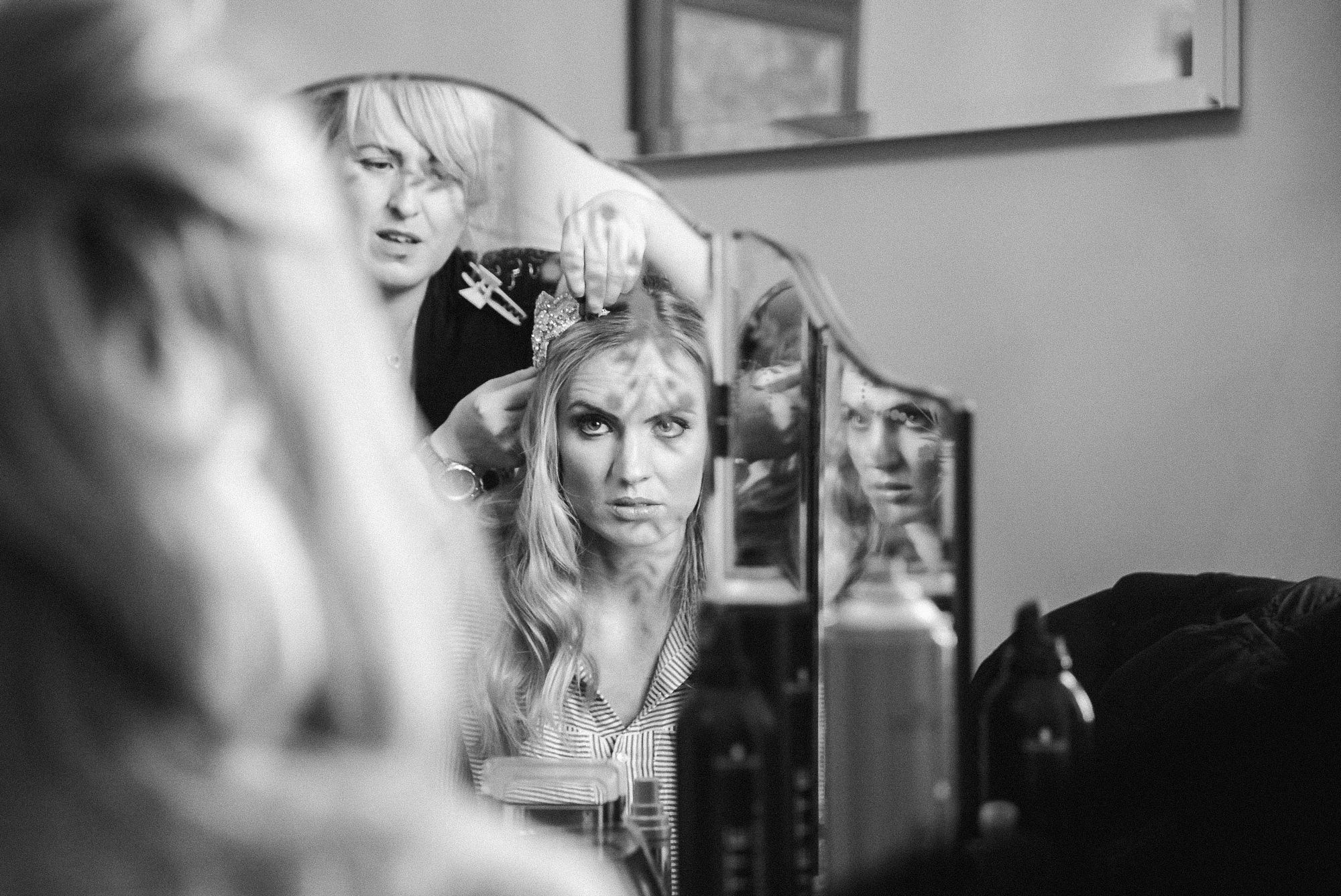 bridal preparations bride getting ready in mirror